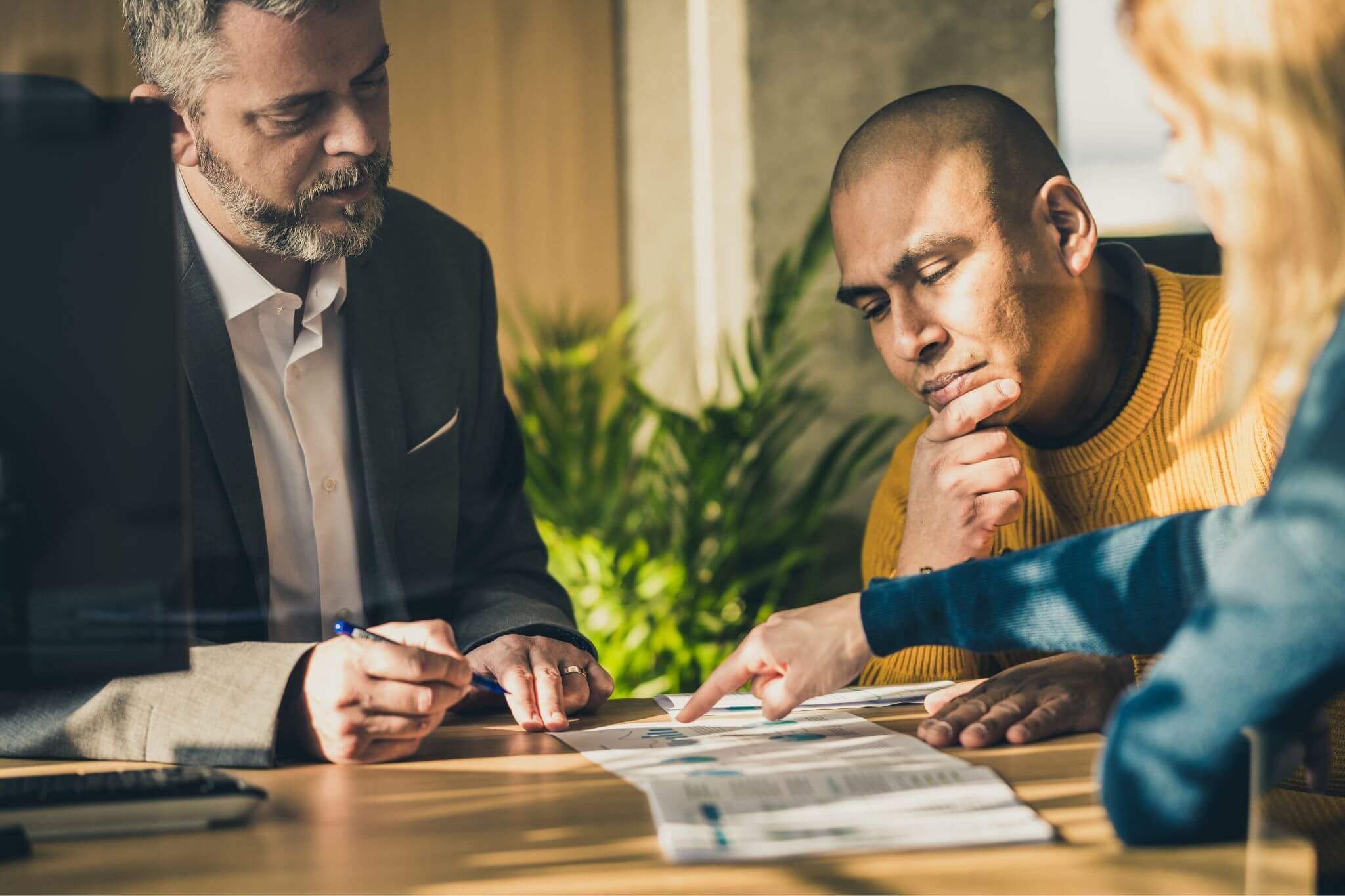 Banker helping a family make personal banking decisions