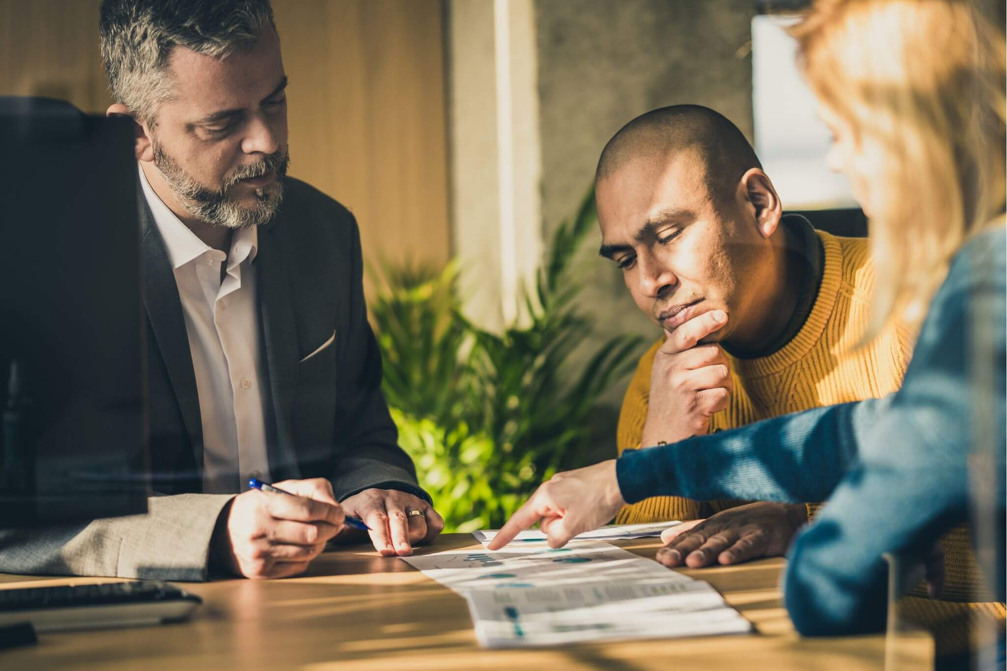 Banker helping a family make personal banking decisions